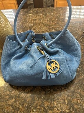 Michael Kors Light Blue Pebbled Leather Drawstring Hobo with Tassel
